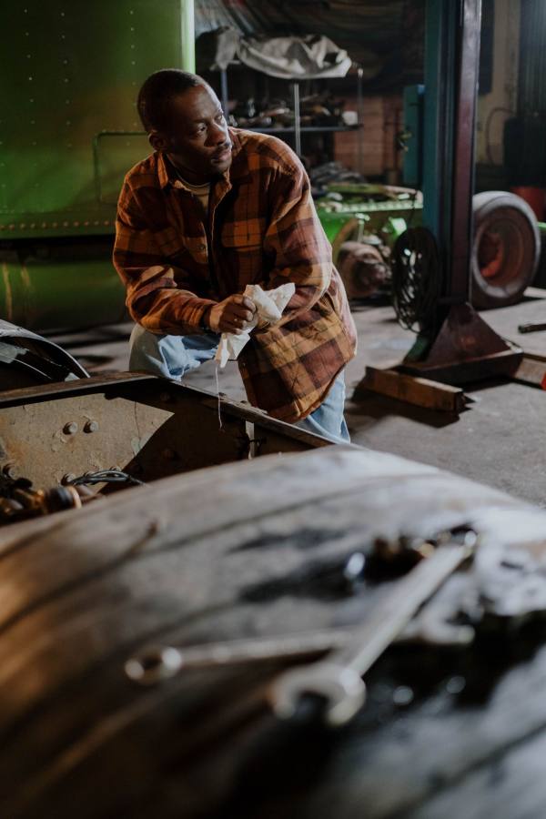 Mechanic with tools in a garage workshop